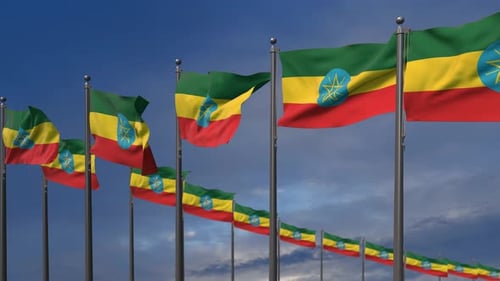 Ethiopian Flags Waving in Wind Against Blue Sky