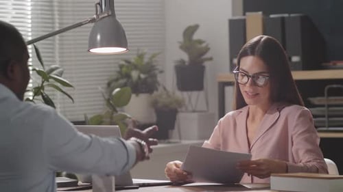 Business Meeting in Bright Office with Documents