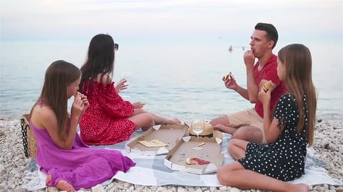 Family Having a Picnic on the Beach