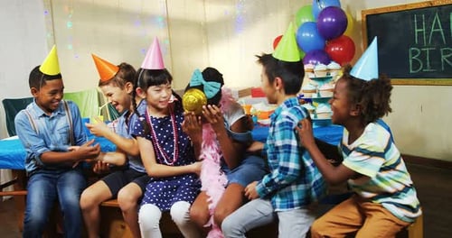 Kids Laughing Together at a Birthday Party