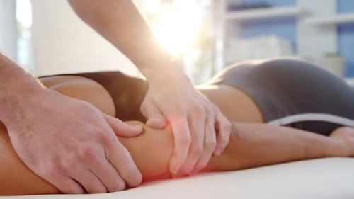 Woman receiving hand massage from physiotherapist