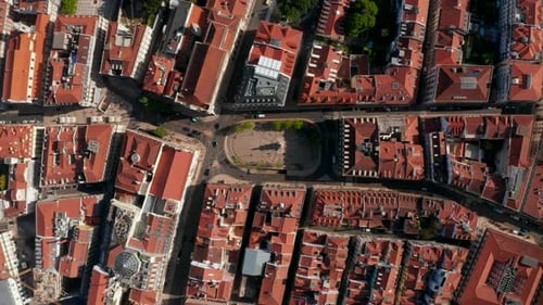 Aerial Birds Eye Overhead Top Down View of Streets and Houses with Red Rooftops in Town