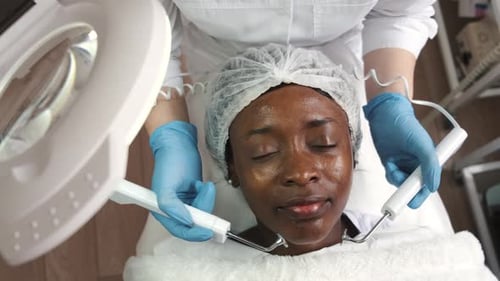 Woman Receiving Facial Treatment in Medical Spa