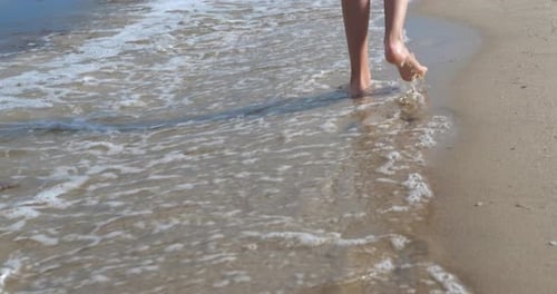 Child Feet on Sand Beach