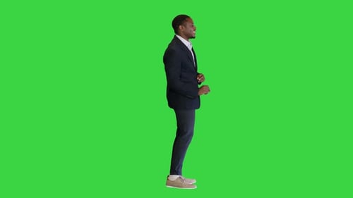 African American Employee Dancing Joyfully on a Green Screen Chroma Key