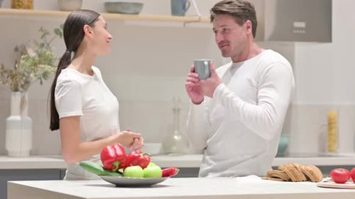 Husband and Wife Talking in the Kitchen