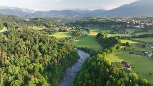 Flying over a river in mist on a beautiful sunrise