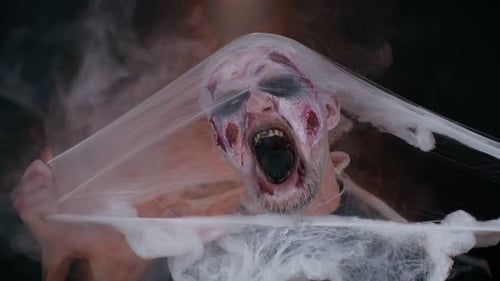 Scary Monster Man with White Webbing Screaming