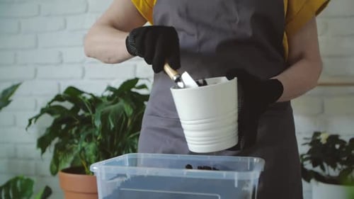 Planting Potting Soil With Trowel Gardening Indoors