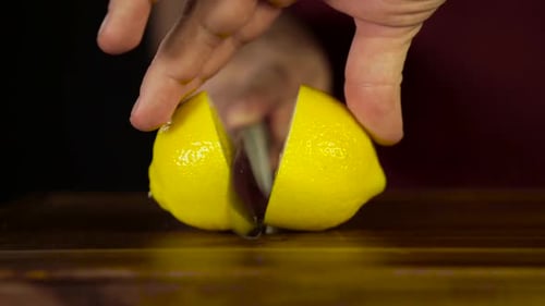 Cutting a Juicy Yellow Lemon in Half