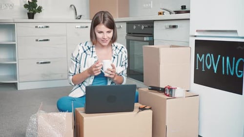 Joyful Female Use App for Call in Flat