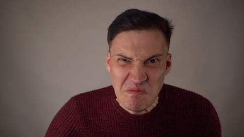 Portrait of Angry Man on White Background