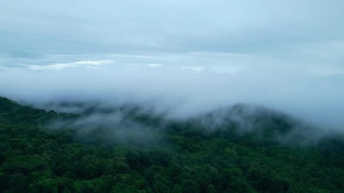 4K Aerial Drone shot flying over beautiful mountain ridge in rural jungle bush forest.