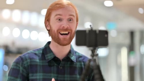 Man Recording Video on Smartphone