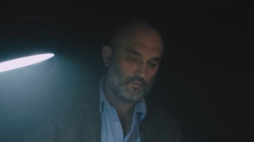 Bearded Stylish Writer Typing on Typewriter. Writer Working on New Book in Office.