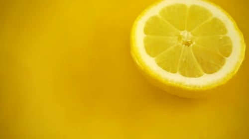 Lemon Slice Floating in Yellow Liquid Close-Up