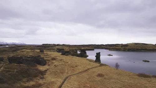 Aerial Landscape View of Vast Lands With Surrounded By Calm Waters of Lake