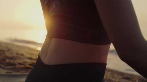Sporty Woman Sitting Lotus Position Practicing Yoga Asana at Sunset Close Up