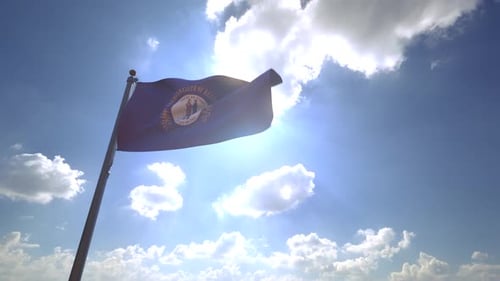 Kentucky State Flag Waving in Sunlight Against Blue Sky