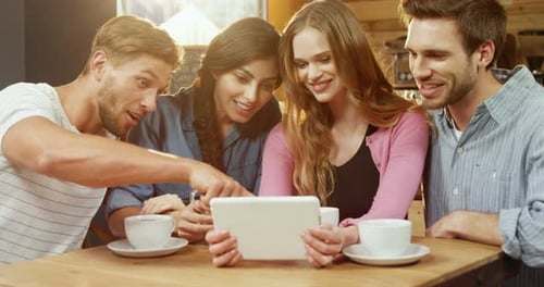 Group of friends using digital tablet