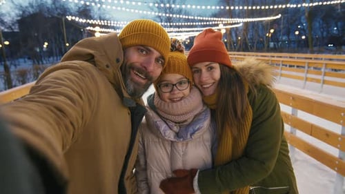 Happy Family Taking Selfie on Winter Evening