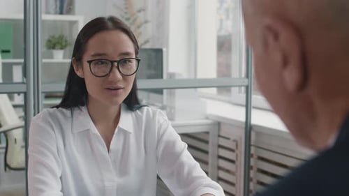 Young Adult Woman in Business Meeting Conversation