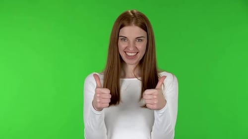 Young Woman Showing Thumbs Up and Down Gestures