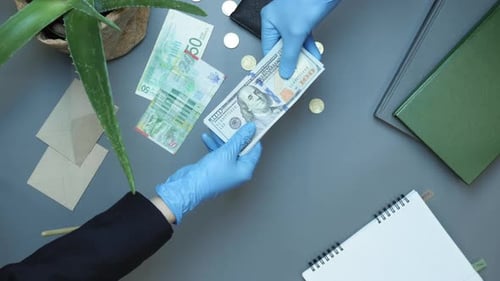 Currency Exchange with Blue Glove Protection