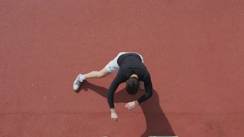 Man doing side lunges