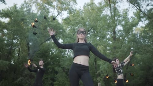 Three Fire Performers Show off Their Skills Outdoors