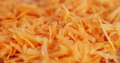 Close Up of Freshly Grated Bright Orange Carrots