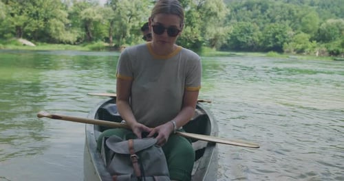 Couple Kayaking on Lake on River and Having Adventure in Nature