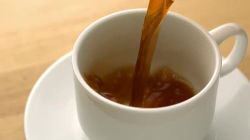Fresh Coffee Pours Into Ceramic Mug