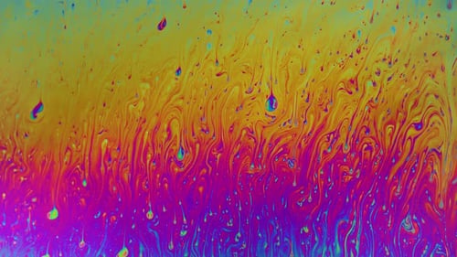 Macro soap bubble creates a colorful and psychedelic background