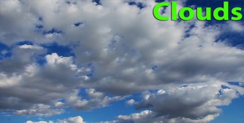 White Clouds Moving Slowly Across Blue Sky