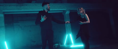 Dancers Performing in Dark Urban Neon Lit Space