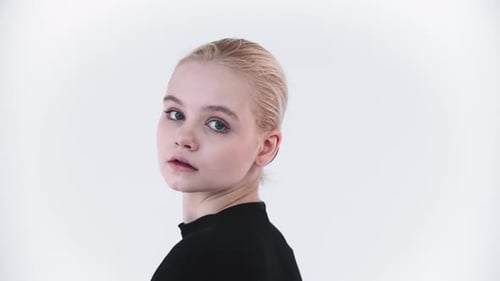 Young Woman in Hairnet Looking at the Camera
