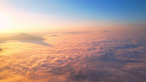 4K Sun is rising above sea of clouds until the horizon