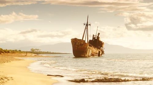 Rusty Broken Shipwreck on Seashore