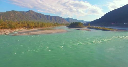Low Altitude Flight Over Fresh Fast Mountain River with Rocks at Sunny Summer Morning