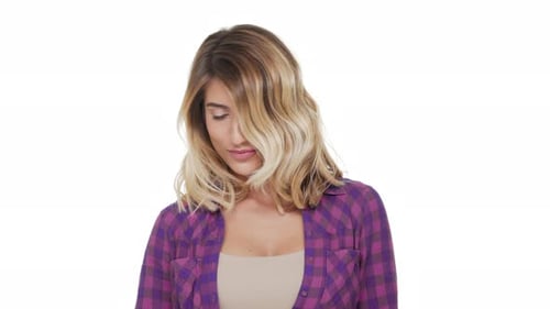 Blond Woman Smiling at Camera with Plaid Shirt