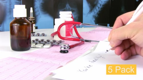 Medical Equipment and Hand Writing Healthcare Concepts