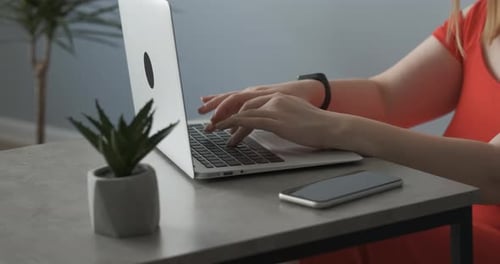 Close Up Woman in the Red Dress Working By Laptop From Home Female Freelancer at Work Remote Job