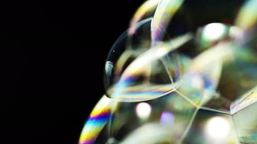 Macro Shot of Interconnected Iridescent Soap Bubbles