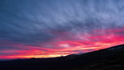 Colorful Sunrise Over a Distant Mountain Range