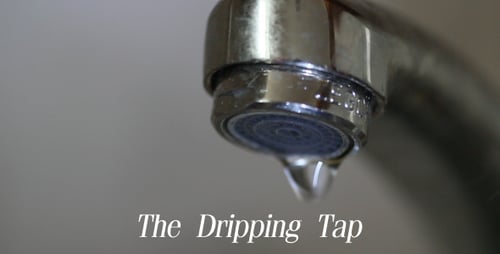 Water Dripping Steadily From Chrome Faucet