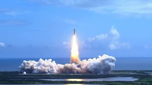 Powerful Space Shuttle Launching Into Blue Sky