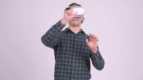 Young Adult Using Virtual Reality Headset and Hand Gestures