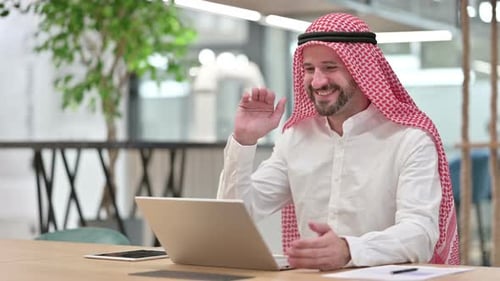 Man Wearing Keffiyeh Having Video Conference Call