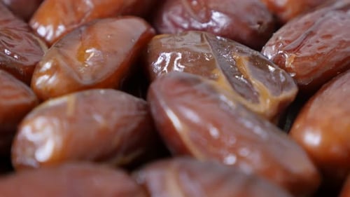 Dried exotic dates palm fruit packed n the original package 4K 2160p 30fps UltraHD tilting footage